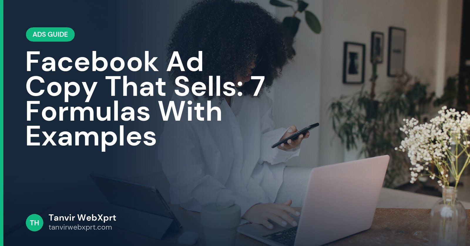 Woman writing Facebook ad copy on a laptop while checking her phone